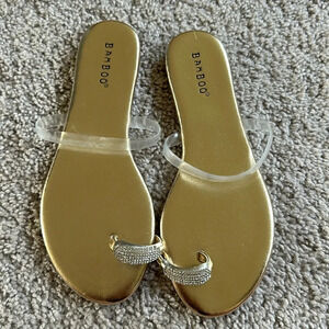Nwot gold sandals w/stone toe detail